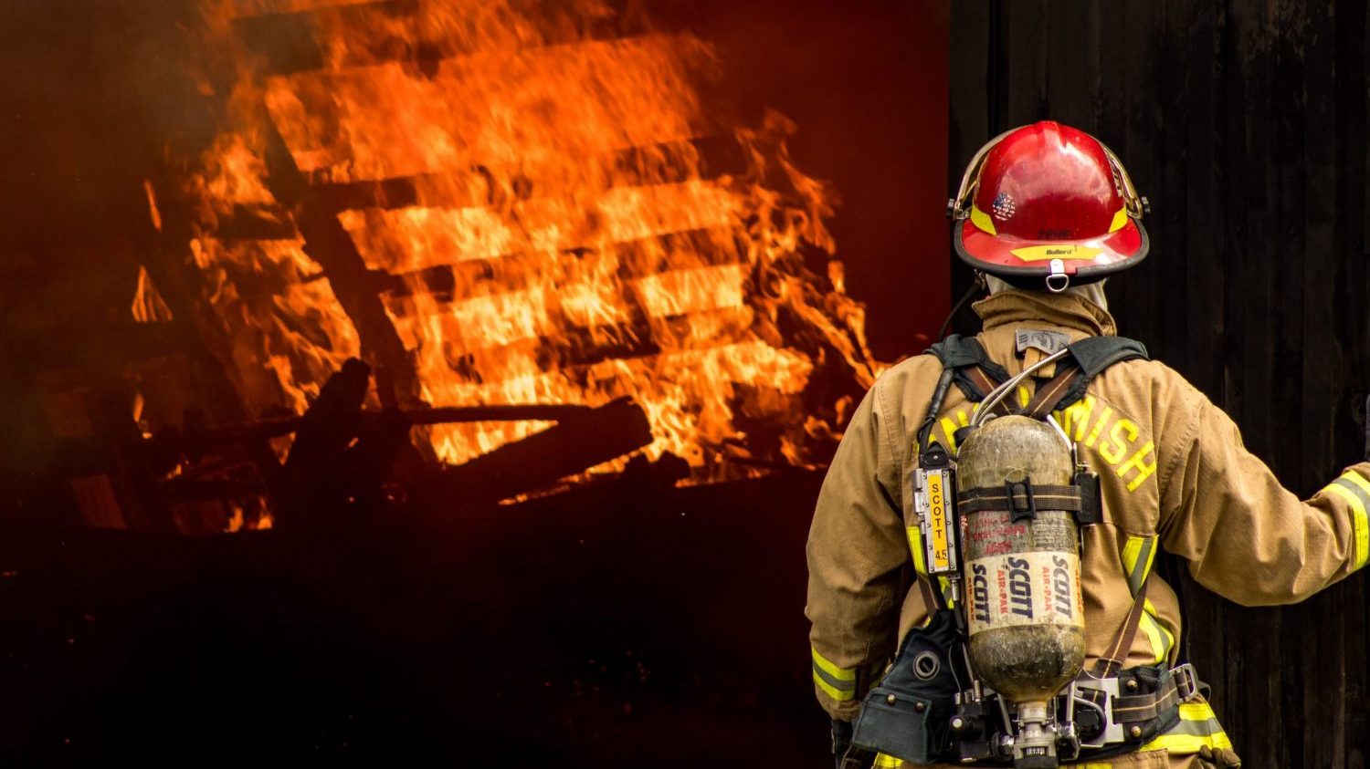 firefighter in front of flames