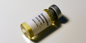 Covid-vaccine vial on a white table