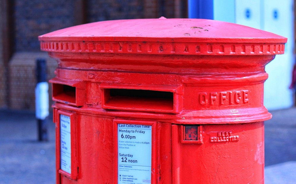 A red Royal Mail letter box