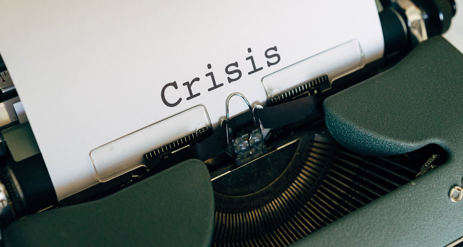 Typewriter with the word crisis